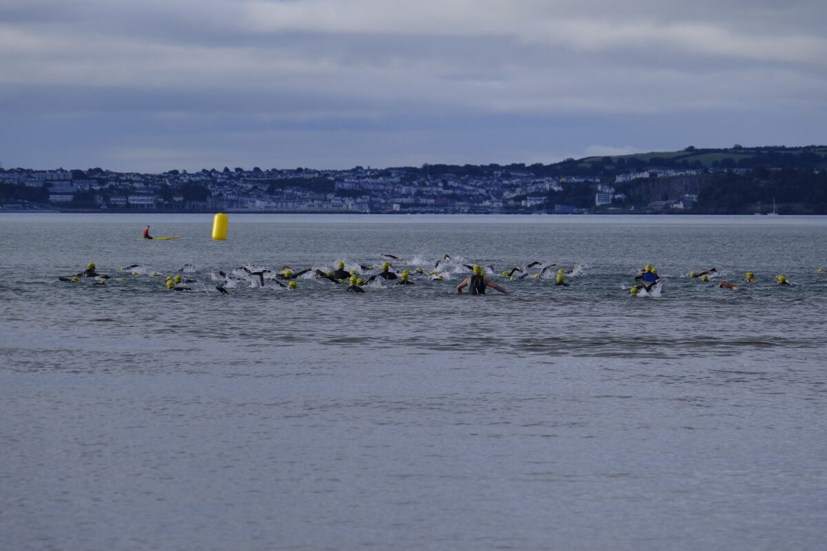 Athletes beginning the English Riviera sea swim from Torre Abbey Sands